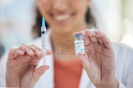Photo for Hands, needle and vaccine bottle with person in healthcare, safe from covid with closeup, medicine and treatment. Health, syringe and immunity from virus, pharmaceutical and injection for protection. - Royalty Free Image
