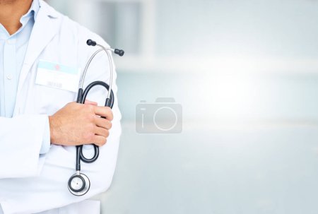 Photo for Closeup, mockup space and doctor with stethoscope, man and medicine with surgeon, physician and hospital. Zoom, person or hand with healthcare professional, medical equipment and employee with career. - Royalty Free Image