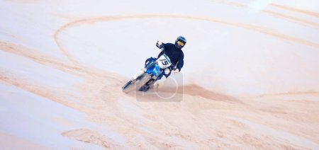 Photo for Race, desert and a person on a bike for travel, extreme sport and adrenaline on a vacation. Sand, competition and a bike or racer for cycling, training or adventure for performance on a motorbike. - Royalty Free Image