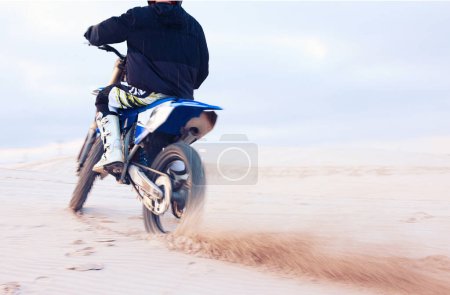 Photo for Desert, dust or driver driving motorcycle for action, adventure or fitness with performance or adrenaline. Sand, back or sports athlete on motorbike on dunes for training, exercise or race challenge. - Royalty Free Image