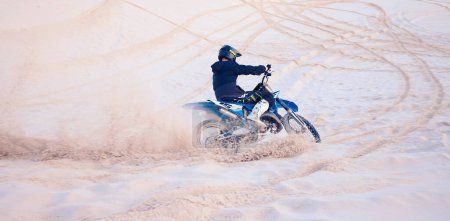 Photo for Dirt, sand or athlete driving motorbike for action, adventure or fitness with performance or adrenaline. Nature, dust or sports driver on motorcycle on dunes in training, exercise or race challenge. - Royalty Free Image