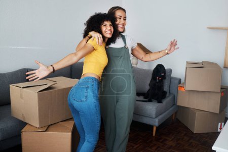 Photo for Lesbian, couple and hug for moving, home and dog in living room with excited, happiness and celebration in apartment or property. Happy, people and women together with boxes and pet in new house. - Royalty Free Image