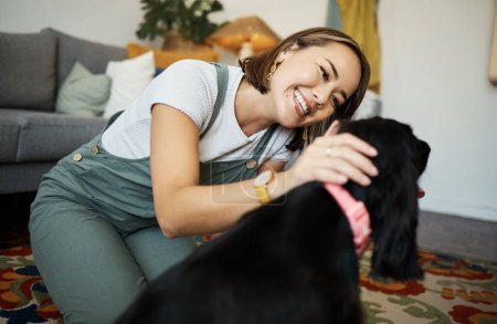 Photo for Love, smile and woman with dog in home lounge to relax and play with animal. Pet owner, happy and asian person on floor with companion, care and wellness or friendship and together in cozy apartment. - Royalty Free Image