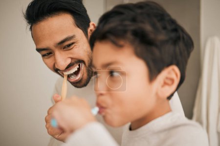 Photo for Face of dad, boy and child brushing teeth for hygiene, morning routine or teaching healthy oral habits at home. Happy father, kid and dental cleaning in bathroom with toothbrush, fresh breath or care. - Royalty Free Image