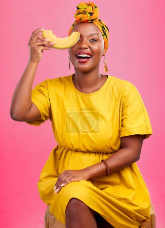 Photo for Melon, portrait and black woman in studio with diet, advice or lose weight with cantaloupe tips on pink background. Fruit, detox and African lady nutritionist with organic, cleanse or raw food advice. - Royalty Free Image