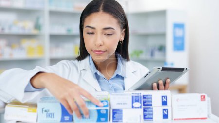 Photo for Medicine, tablet and woman chemist doing research at dispensary for prescription treatment. Medical, digital technology and female pharmacist check stock inventory for medication in drugstore clinic - Royalty Free Image