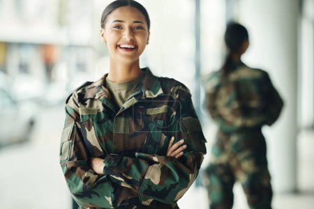 Photo for Portrait, soldier and woman with arms crossed, military and security with a smile, confident and power. Face, person and warrior with pride, camouflage and protection with training, happy and war. - Royalty Free Image