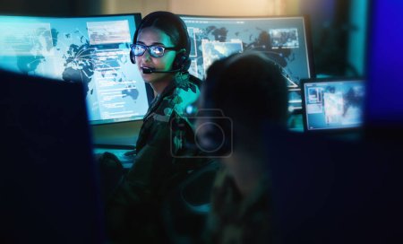 Military control room, headset and woman with man, computer and tech for communication. Security, global surveillance and soldier with teamwork in army office at government cyber data command center