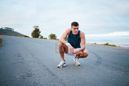 Photo for Sports, nature and man athlete breathing on break of race, marathon or competition training and workout. Fitness, fatigue and tired young male runner resting for outdoor cardio exercise for endurance. - Royalty Free Image