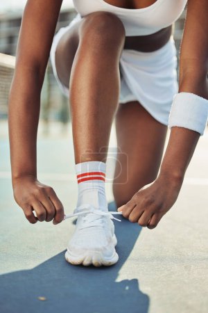 Photo for Woman, shoes and tying laces on tennis court getting ready for sports match, game or outdoor practice. Closeup of female person tie shoe in preparation for fitness, exercise or training workout. - Royalty Free Image