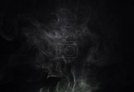 Photo for Smoke, black background and incense, fog or gas on mockup space wallpaper. Cloud, smog and magic effect on dark backdrop of steam with abstract texture, pollution pattern or mist vapor moving in air. - Royalty Free Image