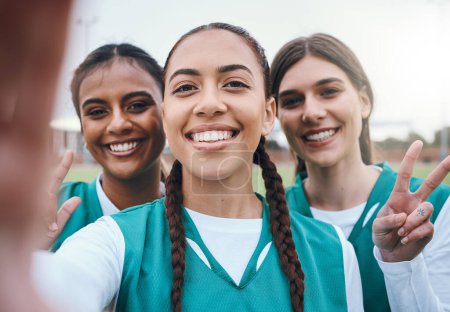 Photo for Sports women, team selfie and peace sign on field for memory, competition and portrait for fitness. Girl group, photography and post on social media with emoji, v icon and diversity for hockey game. - Royalty Free Image