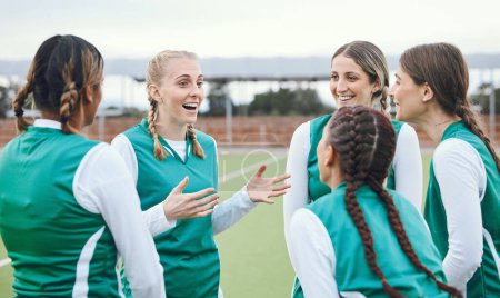 Photo for Sports, hockey team and women talking outdoor at field together for competition training. Fitness, happy group of girls and collaboration for workout, exercise for healthy body and planning strategy. - Royalty Free Image