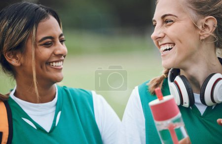 Photo for Laughing, team sports or women in conversation on turf or court for break after fitness training or exercise. Smile, happy friends or funny female hockey players speaking or talking to relax together. - Royalty Free Image