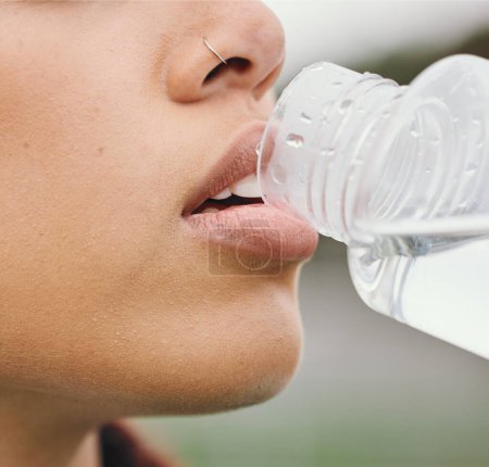 Photo for Outdoor, closeup and woman drinking water, fitness and tired with nutrition, bottle with aqua and workout. Person, runner and athlete with hydration, liquid or thirsty with health, sports and detox. - Royalty Free Image
