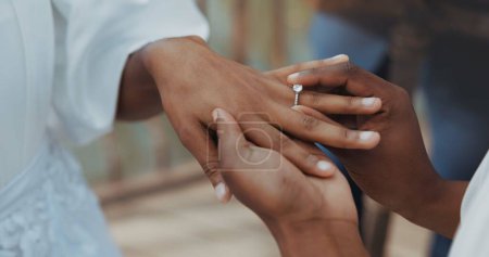 Photo for Couple, holding hands and jewellery for wedding, commitment or marriage union or ceremony with closeup outdoor. People, man and woman getting married for love, celebration and support with ring bond. - Royalty Free Image