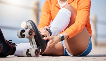 Photo for Woman, hands and shoes to roller skate outdoor for exercise, workout or training with wheels on sidewalk or ground. Start, sport and person with cardio, fitness or rollerskating gear in summer. - Royalty Free Image