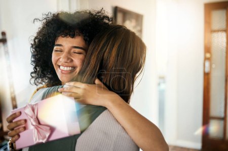 Photo for Excited, hug and present box for birthday of girl friends and smile with gratitude together. Surprise, gift and happy female person at home with giving and celebration, congratulations and package. - Royalty Free Image