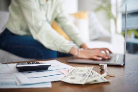 Photo for Laptop, money and calculator with hands for home budget, financial planning and salary, rent cost or loan research. Person typing on computer and sofa with cash and documents, mortgage or bills. - Royalty Free Image