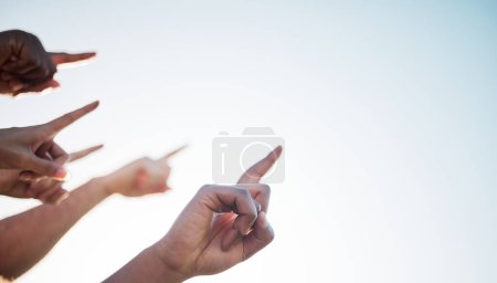 Photo for Fingers, closeup and pointing to sky mockup, collaboration and direction for climate change. Group of diverse hands, wellness, teamwork and solidarity for message in marketing, advertising or vision. - Royalty Free Image
