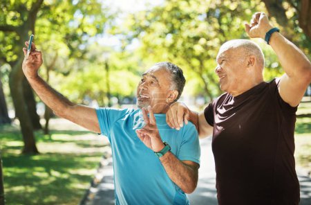 Photo for Friends, men and taking a selfie after exercise in park with peace sign, smile and together for fitness. Mature, people and happy in wellness, workout or cardio in retirement for walk, bond or health. - Royalty Free Image