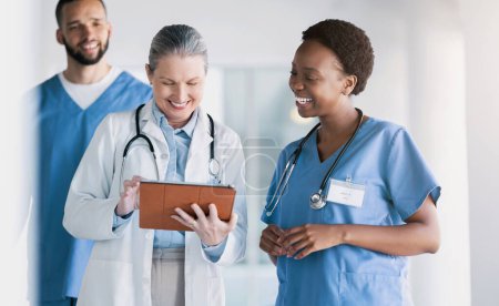 Photo for Doctors, healthcare and teamwork on tablet for online management, mentor advice and research support in clinic. Women, students or nurse on digital technology for medical charts or hospital data. - Royalty Free Image