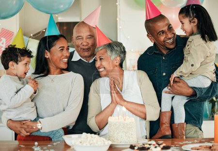 Photo for Happy birthday, grandma or family in home for celebration, bond or growth together. Smile, hat or excited grandparents with cake, love or children siblings in a fun house party or special event. - Royalty Free Image