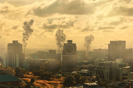 Photo for City, air pollution and gas emissions in sky, urban area and business park with toxic fumes, power plants and energy. Smoke, air and clouds with fog, nature and landscape for steam, vape or danger. - Royalty Free Image