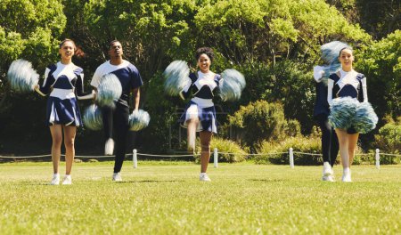 Photo for Motion blur, motivation and a cheerleader group of young people outdoor for a training routine or sports event. Smile, teamwork and diversity with a happy cheer squad on a field together for support. - Royalty Free Image