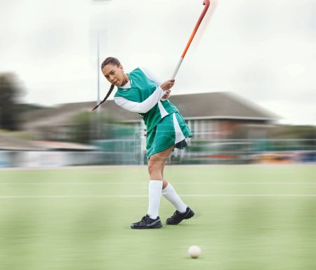 Photo for Hockey, sports or woman in a training game, tournament or competition with ball, stick or action on turf. Blur, strong or fit girl player in exercise, workout or motion on artificial grass for power. - Royalty Free Image