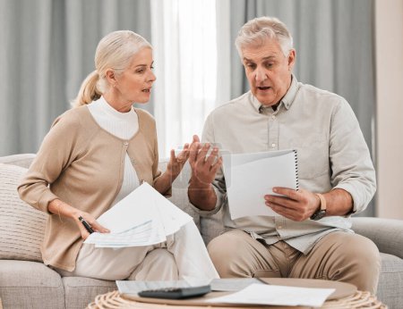 Photo for Stress, old couple with documents and taxes in home, mortgage payment and retirement funding crisis. Financial budget, senior man and woman on sofa with anxiety for bills, life insurance and debt - Royalty Free Image