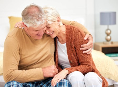 Photo for Funny, hug or happy senior couple with love, care or joy together on sofa at home in retirement. Relax, silly joke or mature people laughing with support, humor or loyalty on house living room couch. - Royalty Free Image