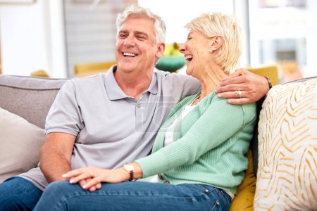 Photo for Funny, laughing or happy senior couple with love, care or joy together on sofa at home in retirement. Relax, silly joke or mature people hug with support, humor or loyalty on house living room couch. - Royalty Free Image