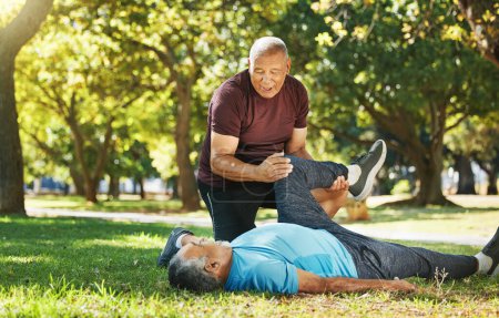 Photo for Stretching, park and men for fitness in retirement, support or help with exercise. Physiotherapy, training and senior coach with elderly athlete for warm up on the grass for sports or rehabilitation. - Royalty Free Image