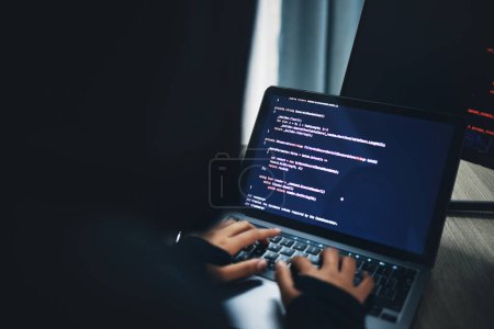 Photo for Person, hands and hacker on laptop at night in cybersecurity, coding malware or software at home. Hacking, working late and typing on computer in programming, algorithm or cyber attack in house. - Royalty Free Image