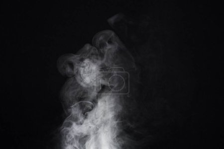 Photo for Smoke, dark background and mist, fog or gas on mockup space wallpaper. Cloud, smog and magic effect on black backdrop of steam with abstract texture, dry ice pattern or vapor of incense moving in air. - Royalty Free Image