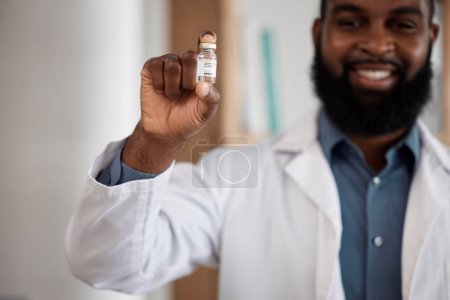 Photo for Doctor, man and vaccine bottle in portrait, smile and care for pharmaceutical product for dengue fever. African medic, pride and happy for medicine, liquid and health innovation for safety in clinic. - Royalty Free Image
