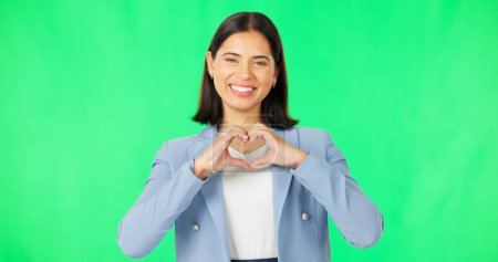 Photo for Portrait, heart hands and woman with green screen, business and kindness on a studio background. Face, happy person and model with promotion, symbol for love and feedback with employee and review. - Royalty Free Image