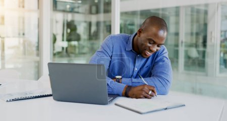 Photo for Business man, writing and planning on computer for financial career notes, information and reminder in office. Professional african accountant on laptop and notebook for happy ideas and brainstorming. - Royalty Free Image