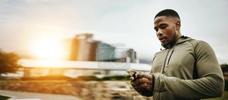 Photo for Black man, phone and technology for communication, workout break or networking outdoor in the morning. Smartphone, person and connectivity for internet, conversation or social media after exercise. - Royalty Free Image