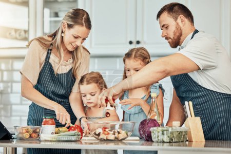 Photo for Happy family in kitchen, cooking together with kids and teaching, learning and nutrition with parents. Mom, dad and girl children help making healthy food in home with care, support and love at lunch. - Royalty Free Image