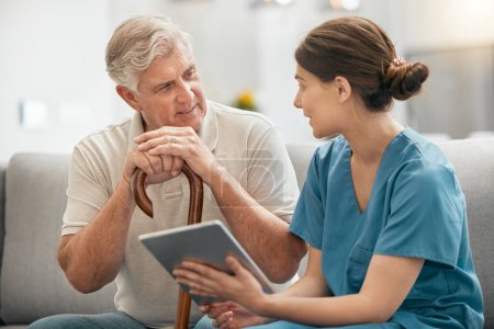 Photo for Woman, nurse and tablet in elderly care, consultation or visit in retirement home for healthcare advice. Female person or medical caregiver talking to retired man or patient with technology on sofa. - Royalty Free Image
