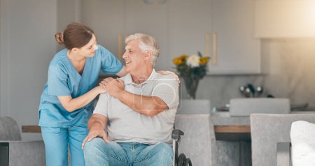 Photo for Woman, doctor and wheelchair in elderly care for support, trust or nursing in retirement or old age home. Female nurse or caregiver talking to senior man or person with a disability in living room. - Royalty Free Image