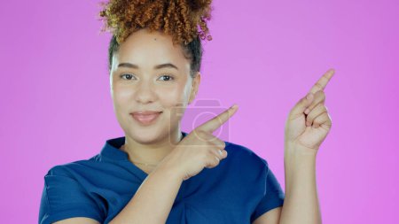 Photo for Woman, portrait and pointing at information for advertising, announcement or offer with smile on pink background. Direction, marketing and news with opportunity, mockup with promo or advice in studio. - Royalty Free Image
