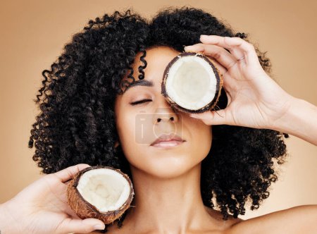 Photo for Relax woman, beauty face or coconut skincare treatment, vegan nutritionist or organic cosmetics, natural antioxidants or self care. Eyes closed, fruit oil benefits or product girl on brown background. - Royalty Free Image
