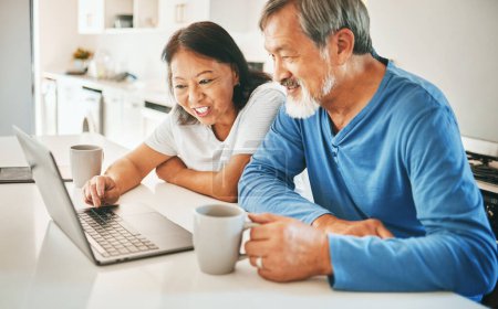 Photo for Home, typing and senior couple with a laptop, conversation and search internet with website info, network and connection. Kitchen, elderly man and old woman with a pc, email notification and talking. - Royalty Free Image