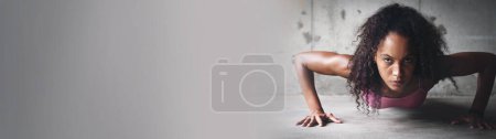 Photo for Fitness, woman and push up on banner for workout, athletic or sports exercise outdoor with serious face. Training, athlete and challenge for wellness, healthy body or strong on mockup space on floor. - Royalty Free Image