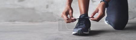 Photo for Fitness, person and tie shoes on banner for athletic, sport or cardio outdoor for workout or exercise. Training, athlete and getting ready for wellness, healthy body or lifestyle on mockup space. - Royalty Free Image
