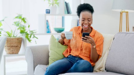 Photo for Coffee, woman and laugh with phone on sofa, reading social media post and mobile chat at home. Happy african person drinking tea, scroll multimedia connection and funny meme online with smartphone. - Royalty Free Image