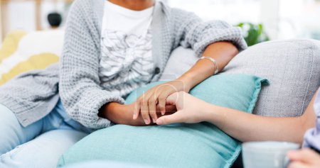 Photo for Love, holding hands and closeup of lesbian couple on sofa talking, bonding and relaxing in living room. Support, care and zoom of lgbtq women with affection in conversation in the lounge at apartment. - Royalty Free Image